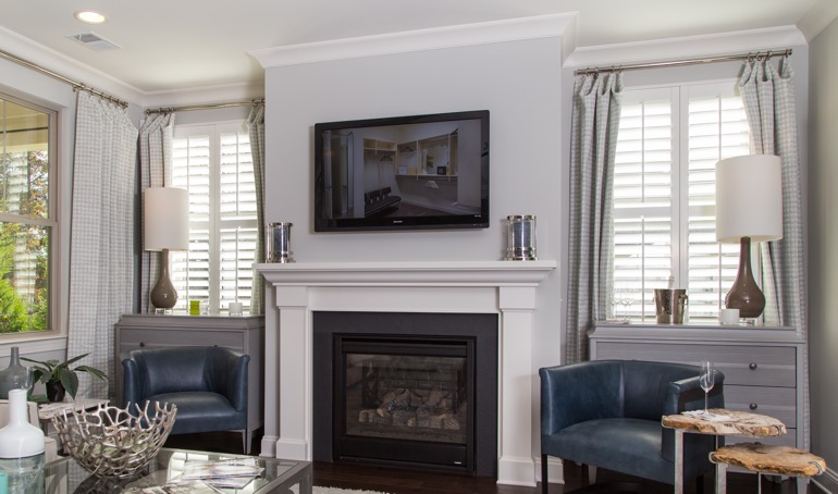 Hartford fireplace with plantation shutters.